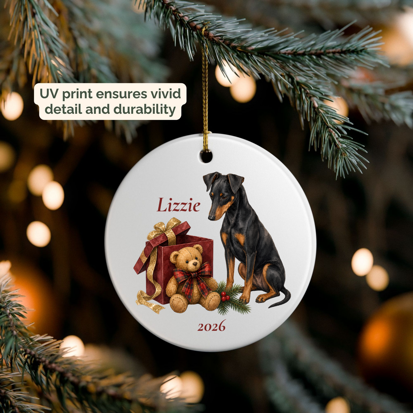 Personalized Manchester Terrier ornament hanging on a lit Christmas tree