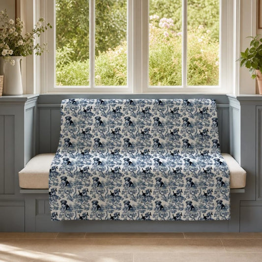 Beagle breed toile blanket on a window seat