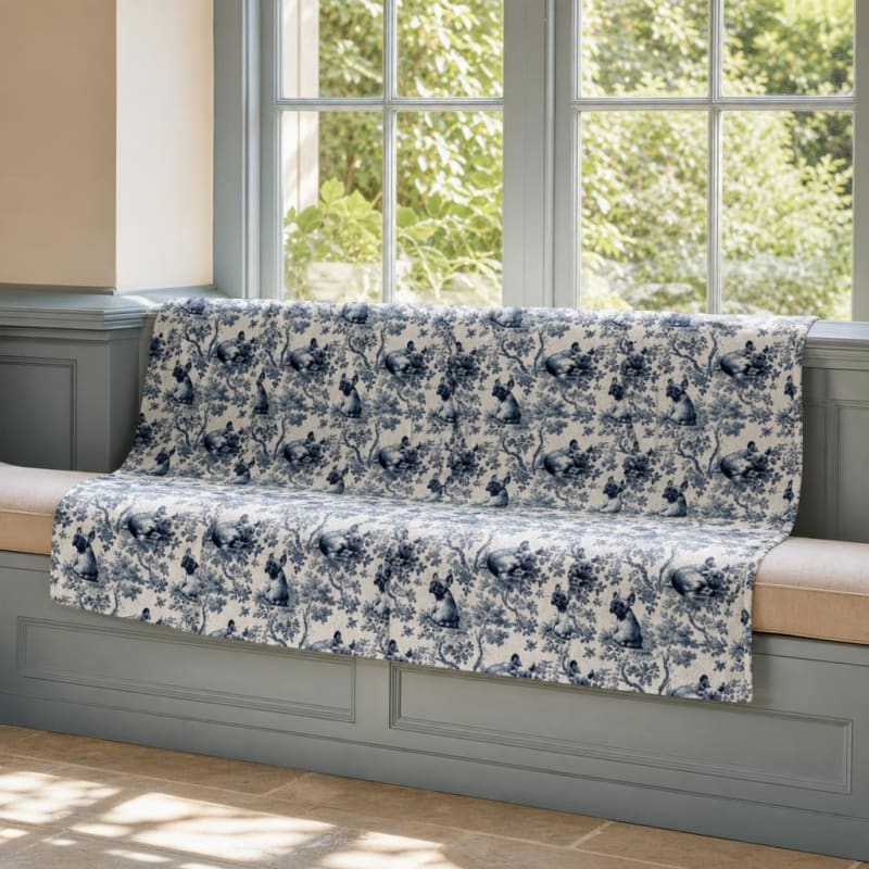 French Bulldog breed toile blanket on a window seat