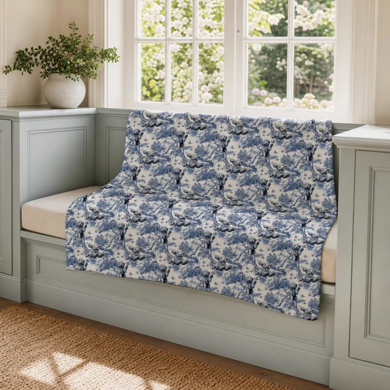 Goldendoodle breed toile blanket on a window seat