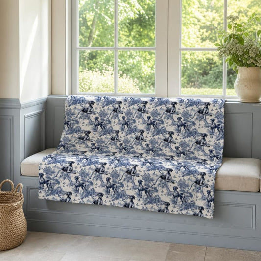 Great Dane breed toile blanket on a window seat