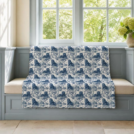 Newfoundland breed toile blanket on a window seat