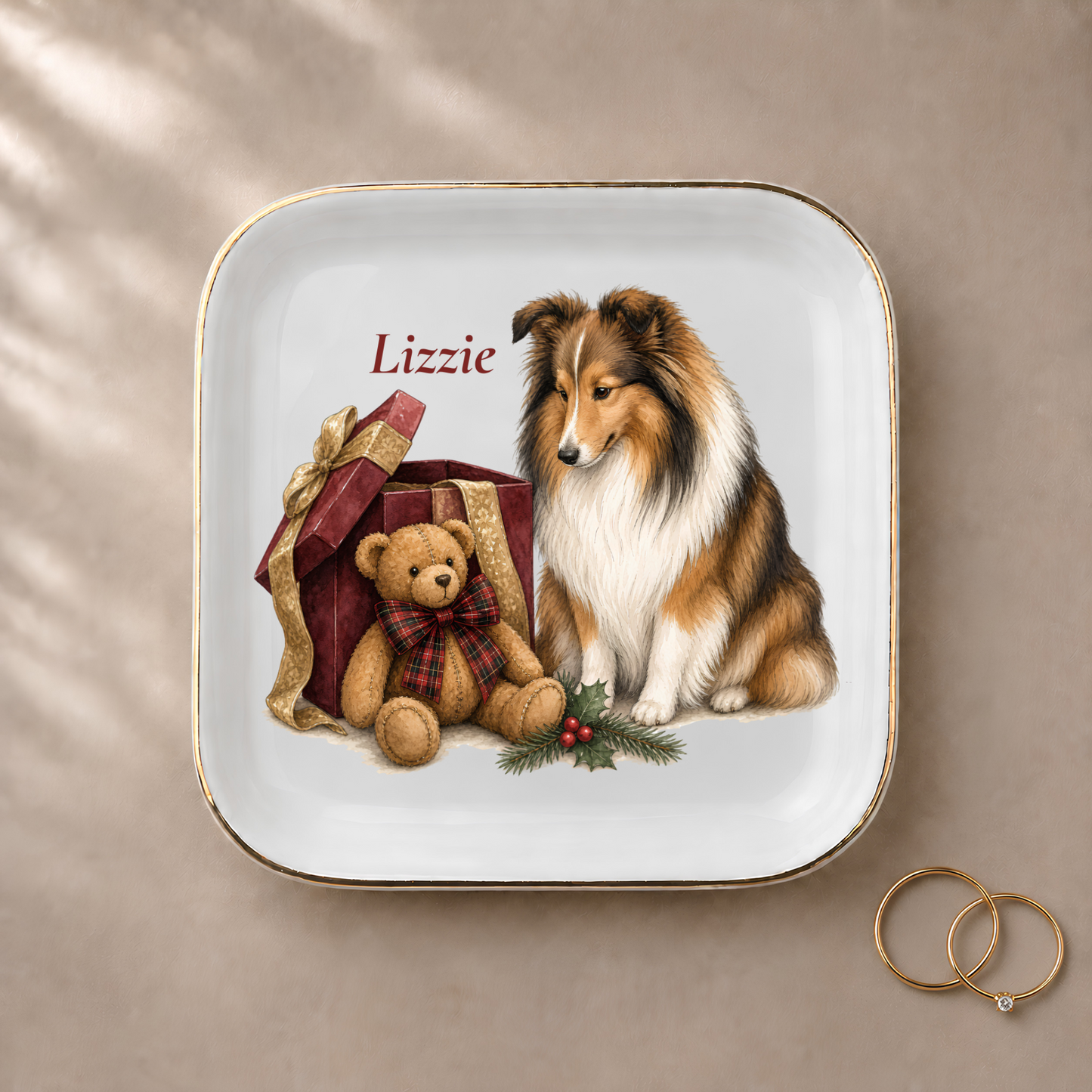 Shetland Sheepdog jewelry dish styled with gold rings and a personalized name