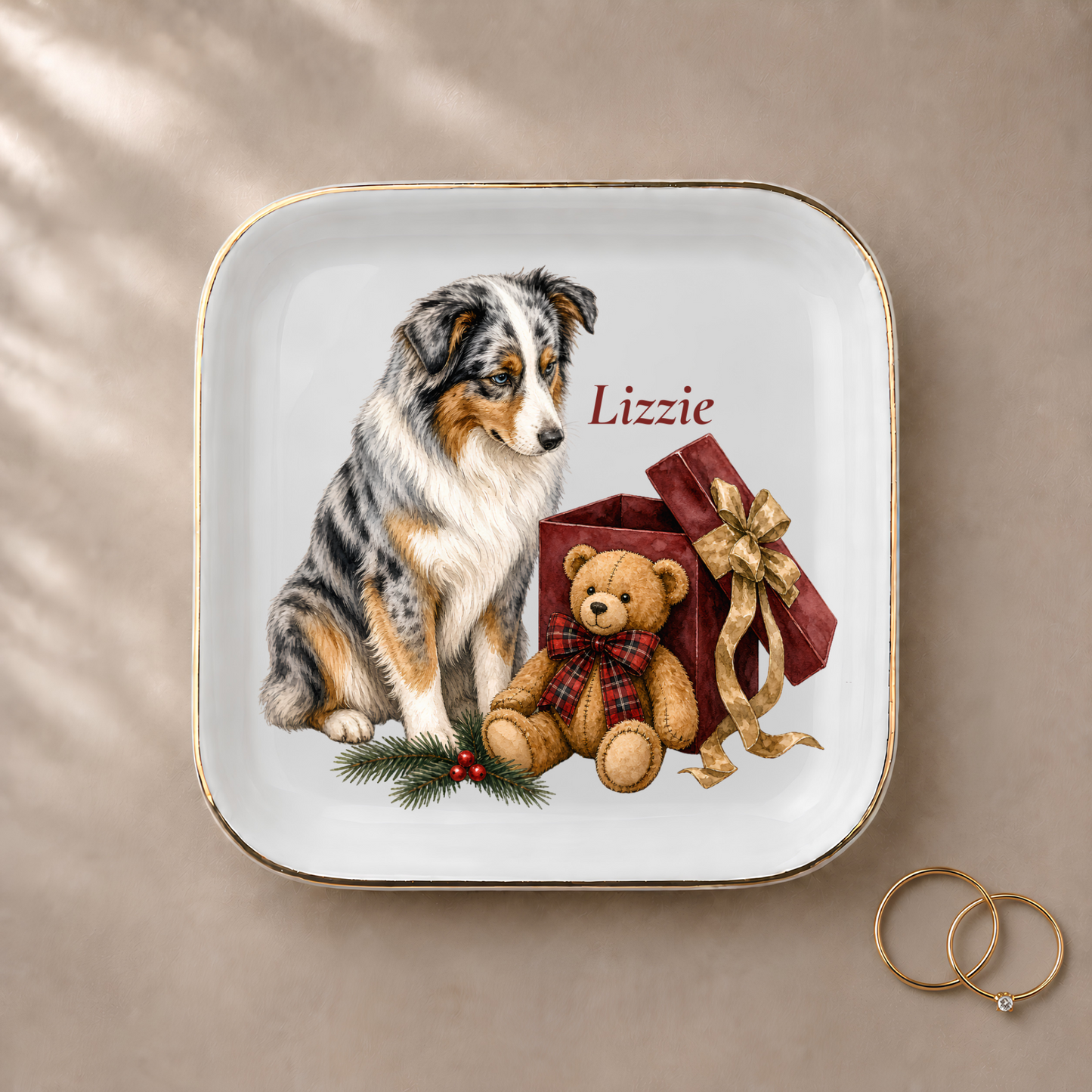 Australian Shepherd jewelry dish styled with gold rings and a personalized name