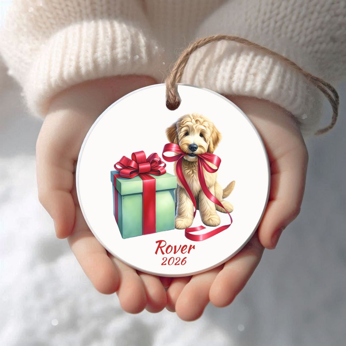 Personalized Goldendoodle Christmas ornament held in cupped hands