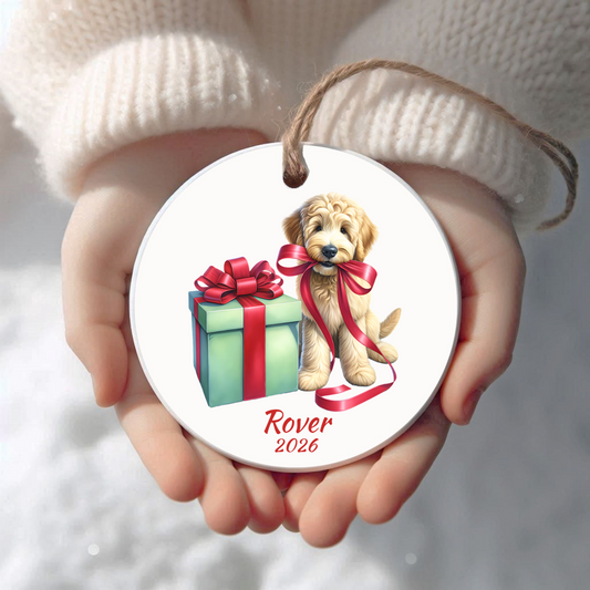 Personalized Goldendoodle Christmas ornament held in cupped hands