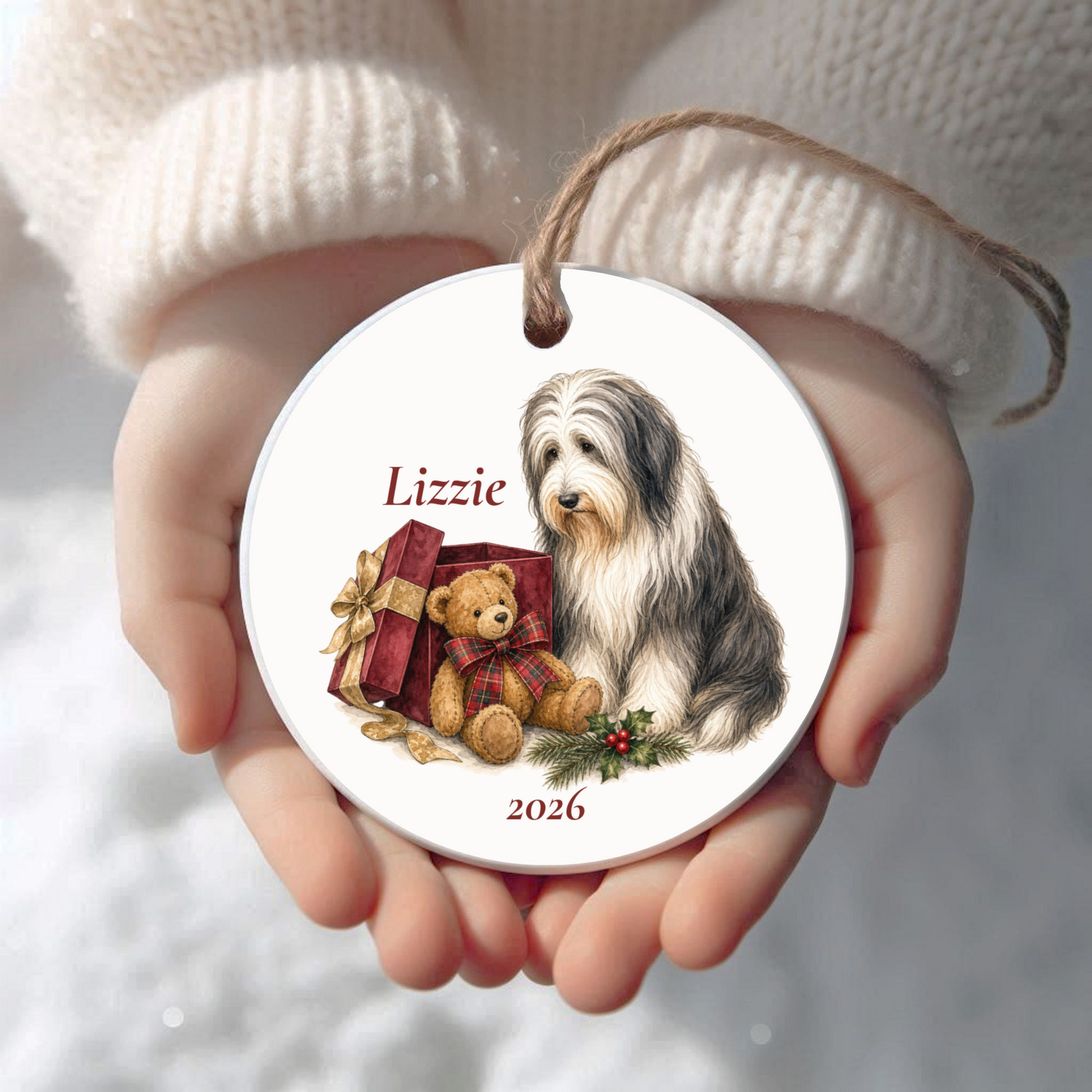 Personalized Bearded Collie Christmas ornament held in cupped hands