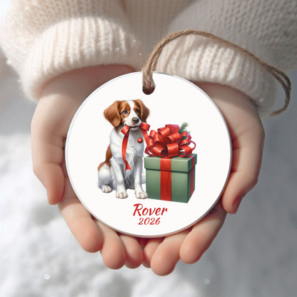 Personalized Brittany Spaniel Christmas ornament held in cupped hands