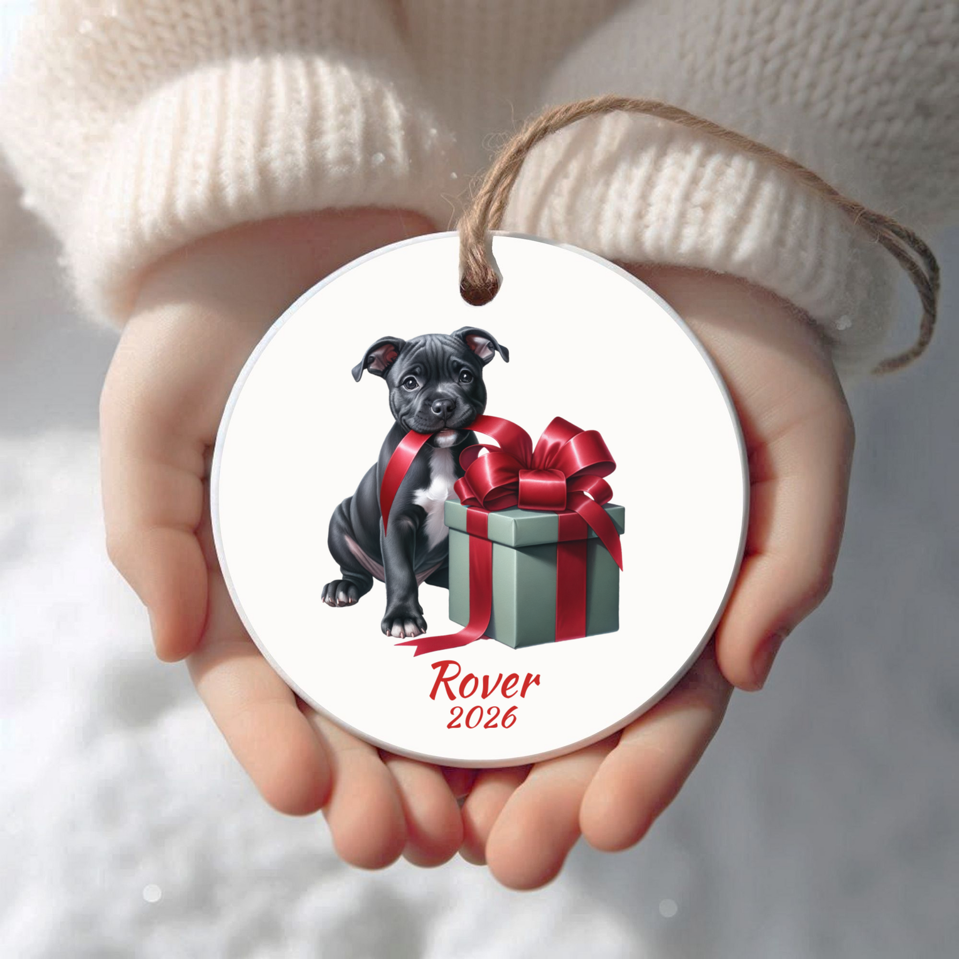 Personalized American Staffordshire Terrier Christmas ornament held in cupped hands