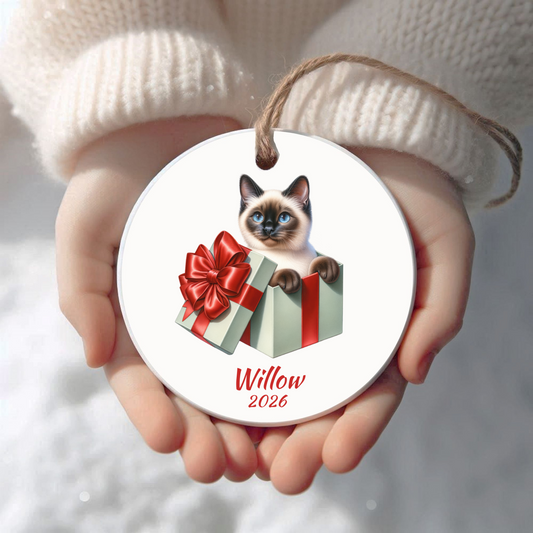 Personalized Siamese Cat Christmas ornament held in cupped hands