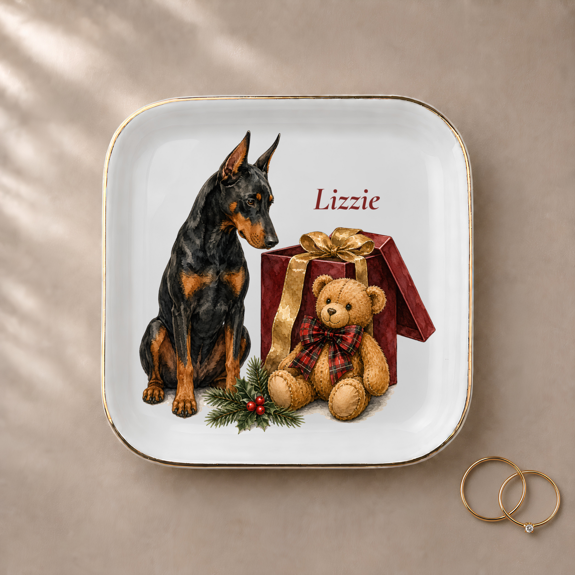 Doberman jewelry dish styled with gold rings and a personalized name