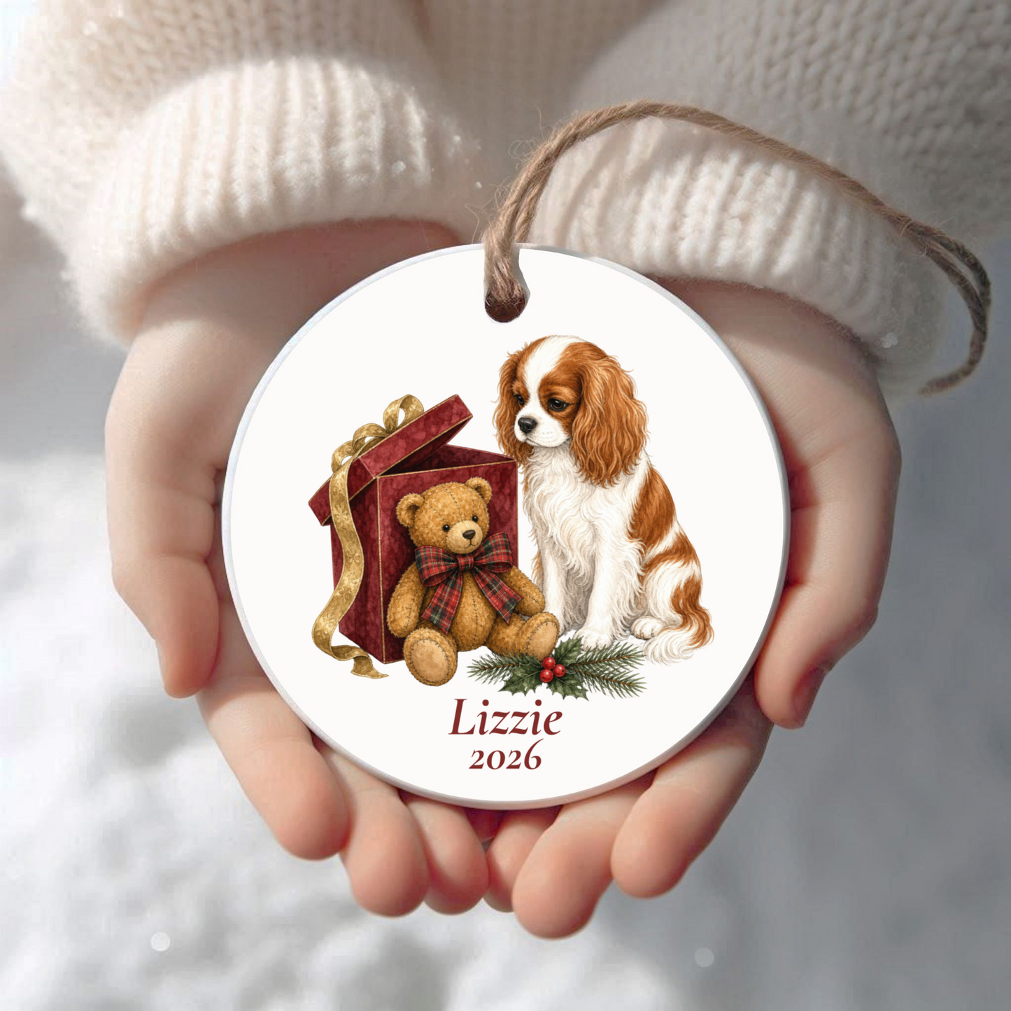 Personalized Cavalier King Charles Spaniel (Blenheim) Christmas ornament held in cupped hands