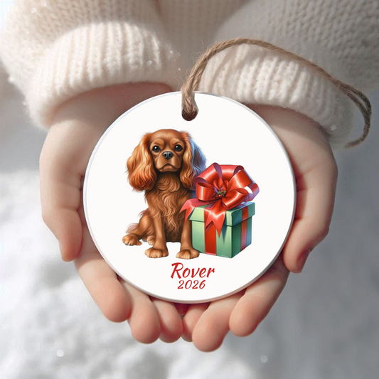Personalized Ruby Cavalier King Charles Spaniel Christmas ornament held in cupped hands