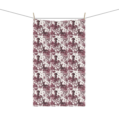 Dachshund Tea Towel with cranberry toile design, hanging from a clothesline, showing the full repeating design.