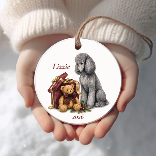 Personalized Silver Standard Poodle Christmas ornament held in cupped hands