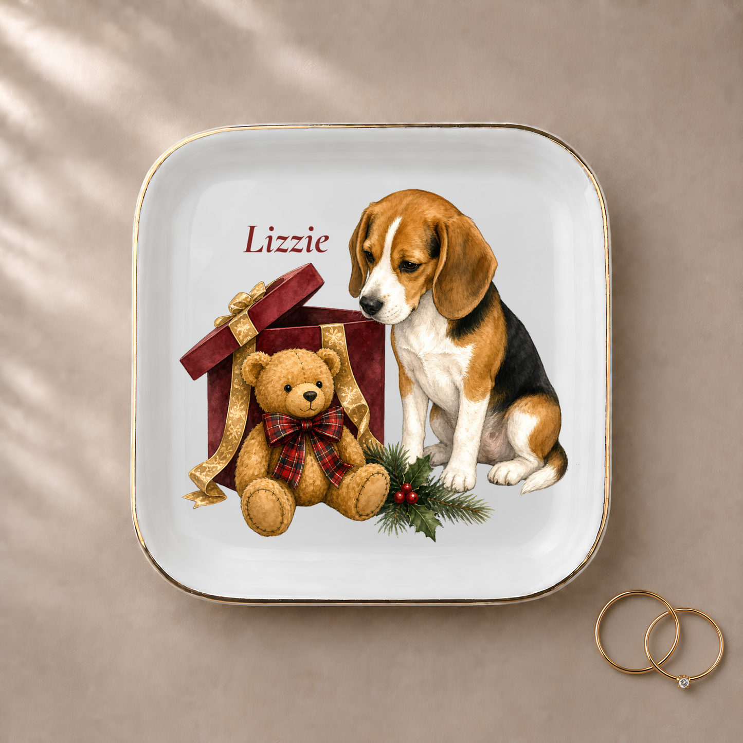 Beagle jewelry dish styled with gold rings and a personalized name