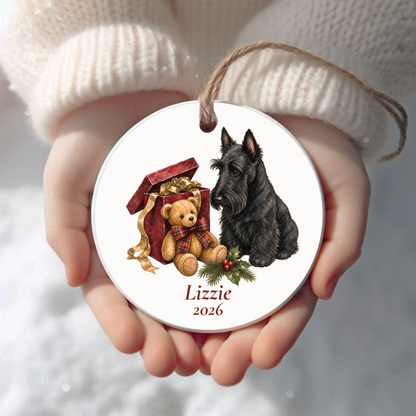 Personalized Scottish Terrier Christmas ornament held in cupped hands