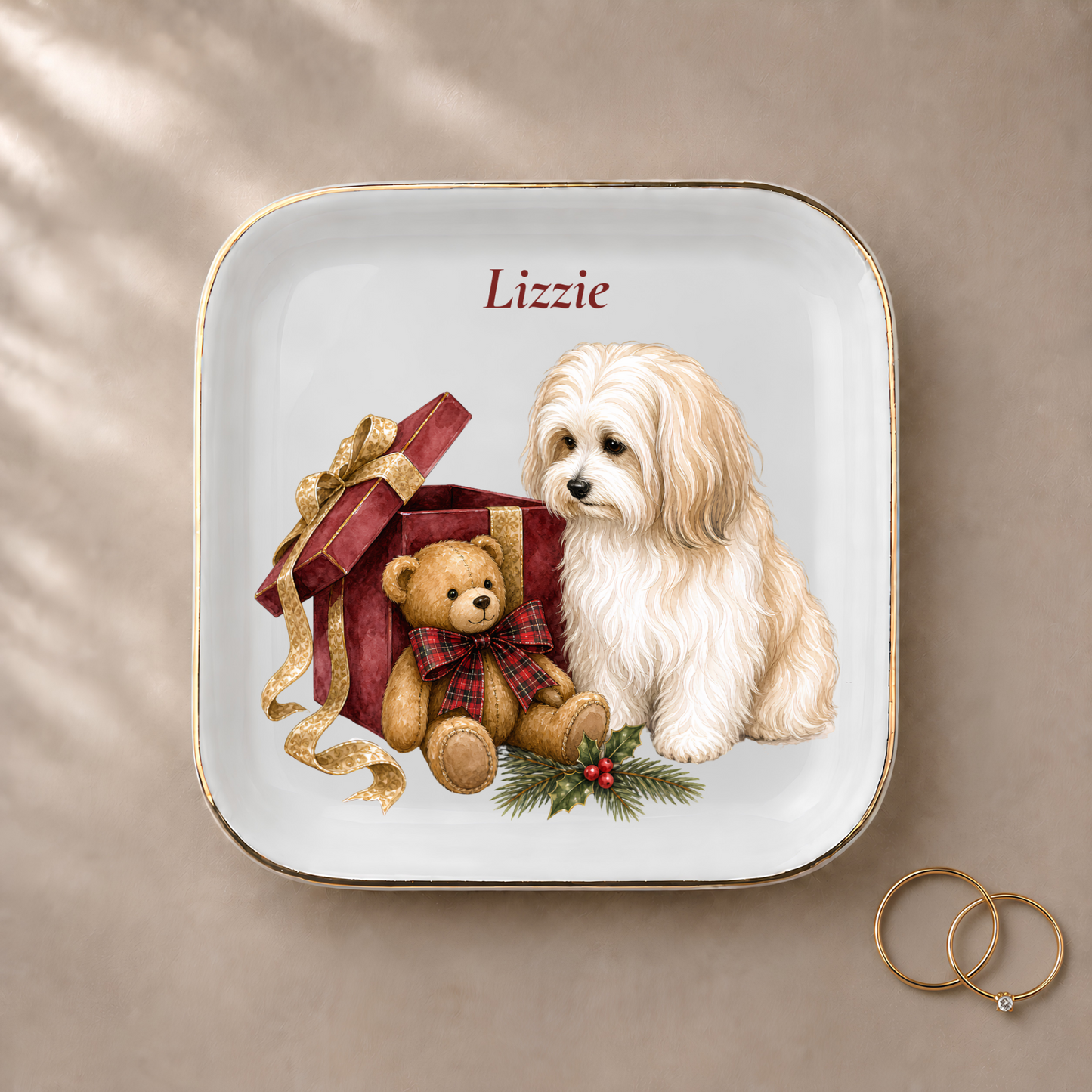 Havanese jewelry dish styled with gold rings and a personalized name