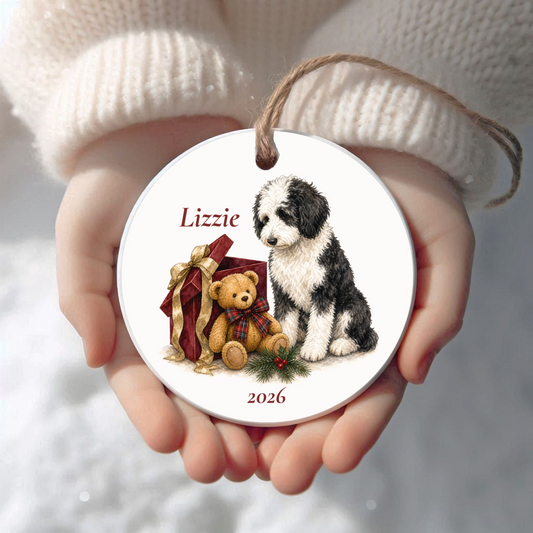Personalized Sheepadoodle Christmas ornament held in cupped hands