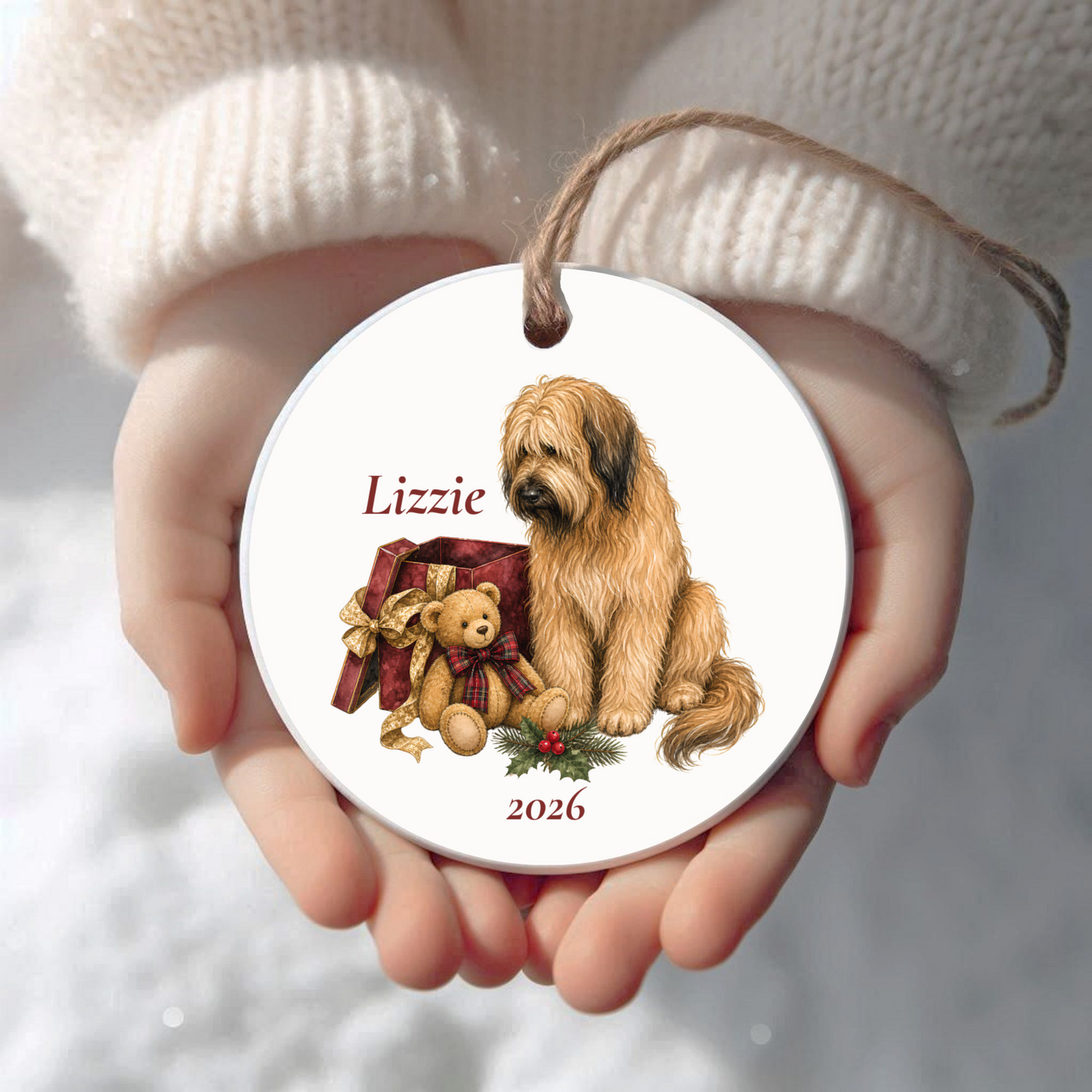 Personalized Briard Christmas ornament held in cupped hands