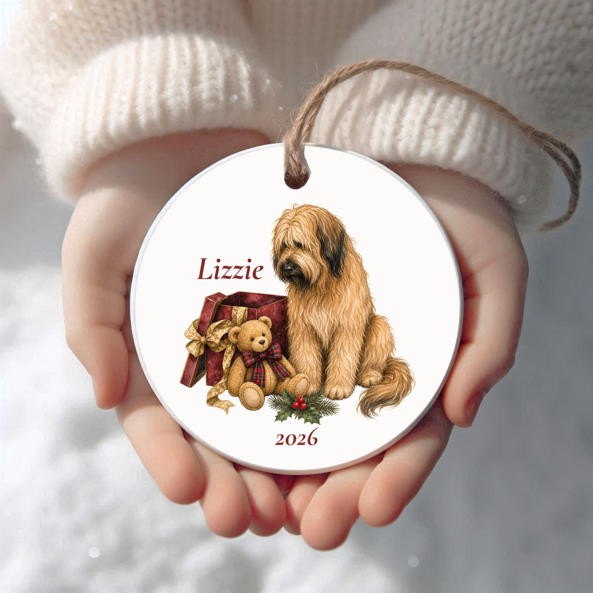 Personalized Briard Christmas ornament held in cupped hands