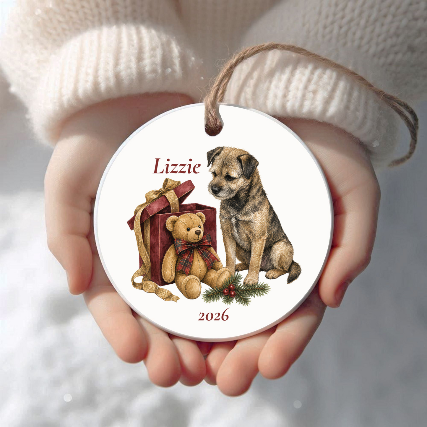 Personalized Border Terrier Christmas ornament held in cupped hands
