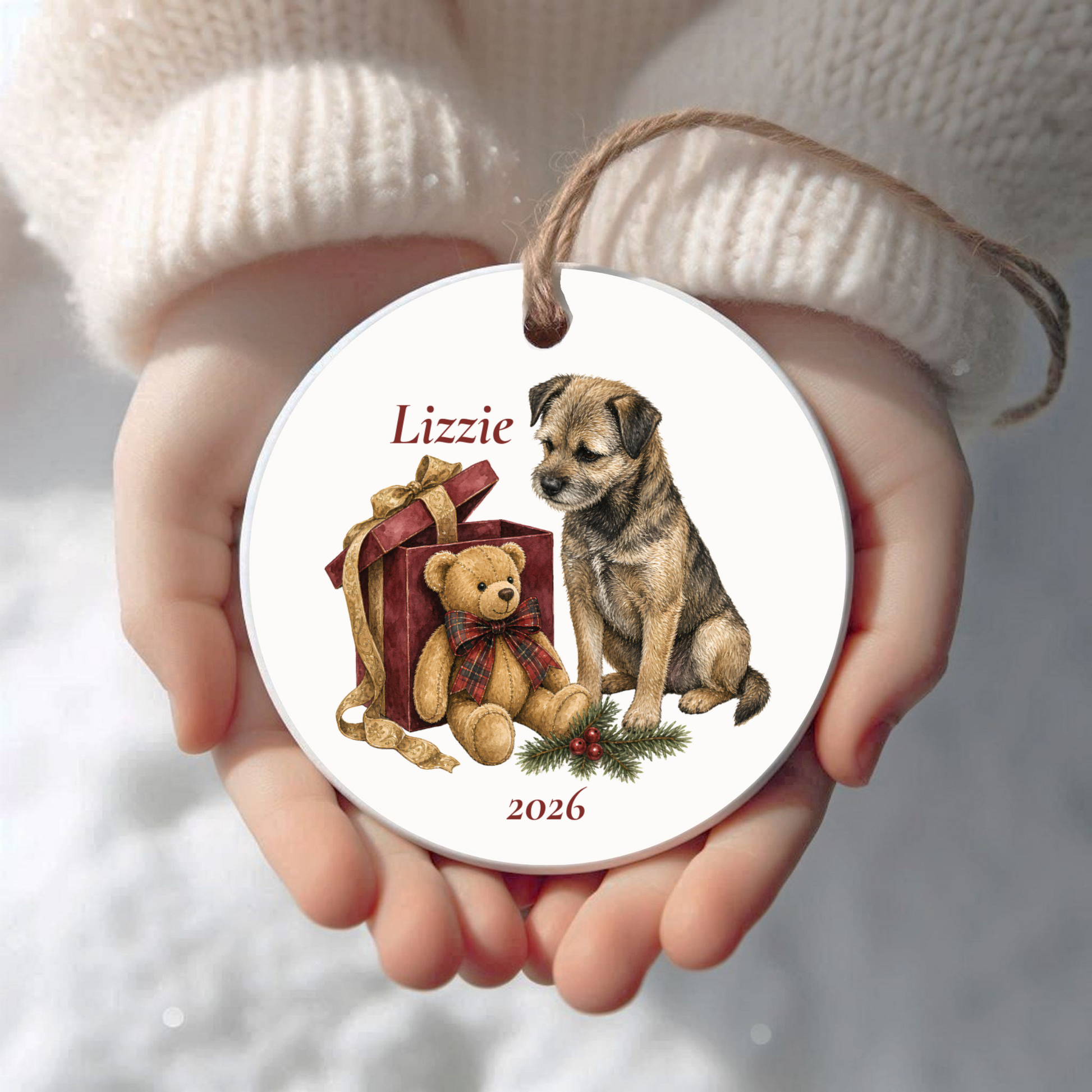 Personalized Border Terrier Christmas ornament held in cupped hands