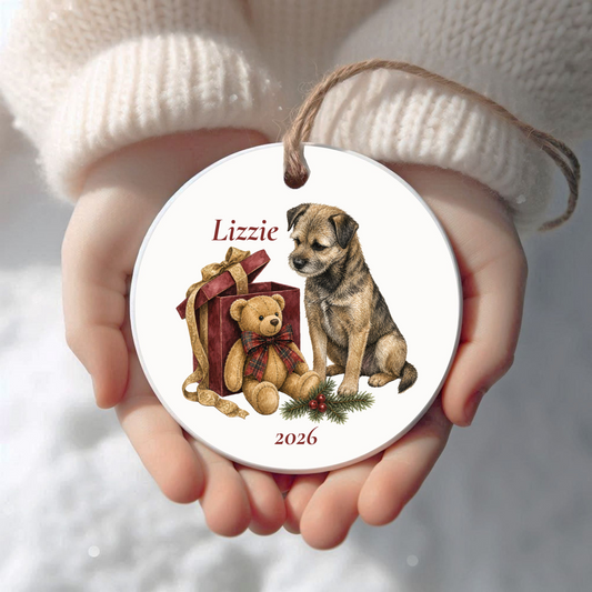 Personalized Border Terrier Christmas ornament held in cupped hands