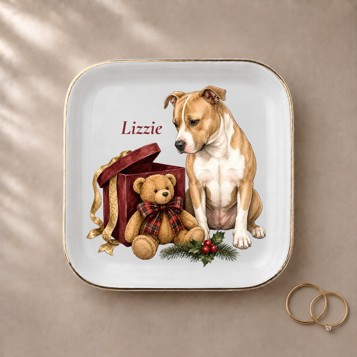 Pitbull jewelry dish styled with gold rings and a personalized name