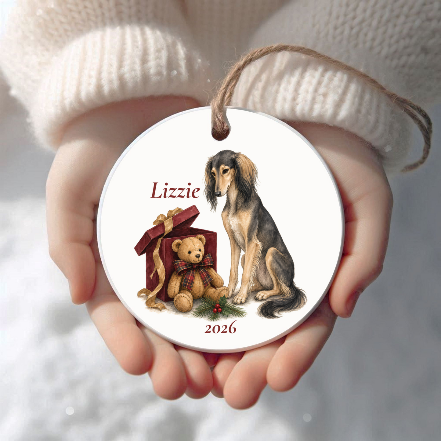 Personalized Saluki Christmas ornament held in cupped hands