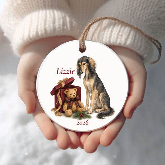 Personalized Saluki Christmas ornament held in cupped hands