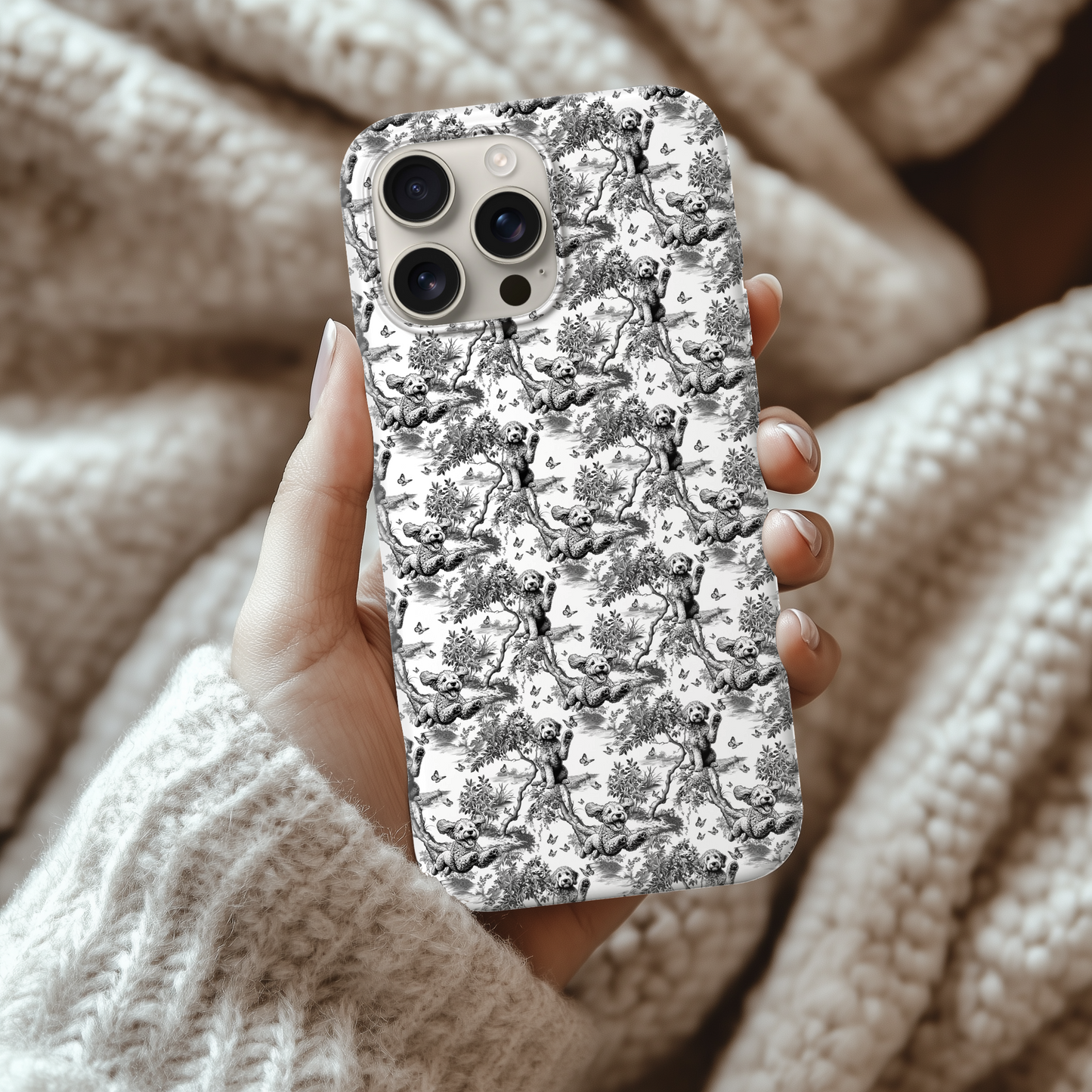 Black toile Goldendoodle phone case held in hand