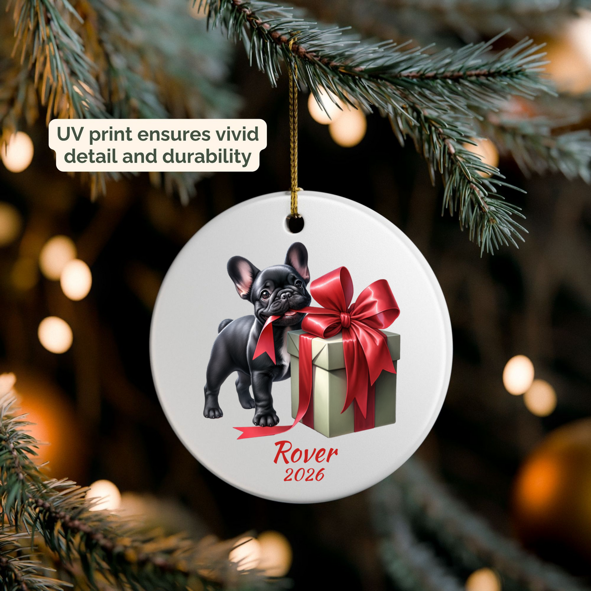 Personalized black French Bulldog ornament hanging on a lit Christmas tree