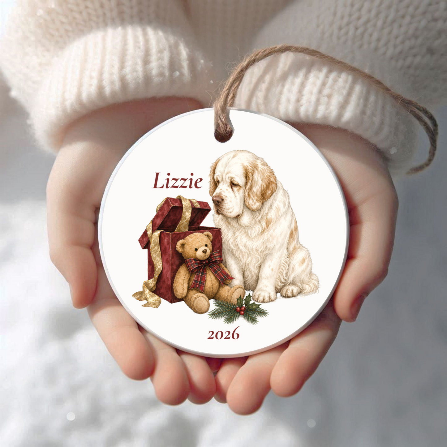 Personalized Clumber Spaniel Christmas ornament held in cupped hands
