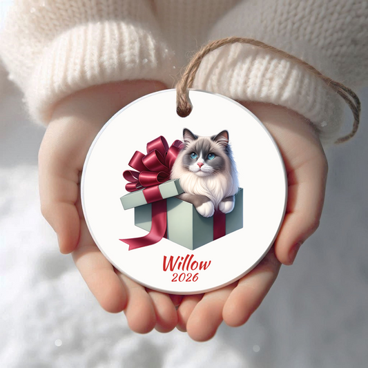 Personalized Ragdoll Cat Christmas ornament held in cupped hands