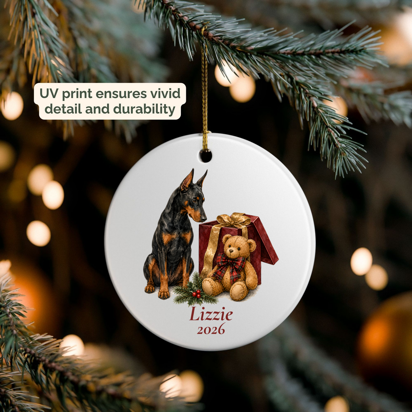 Personalized Doberman ornament hanging on a lit Christmas tree