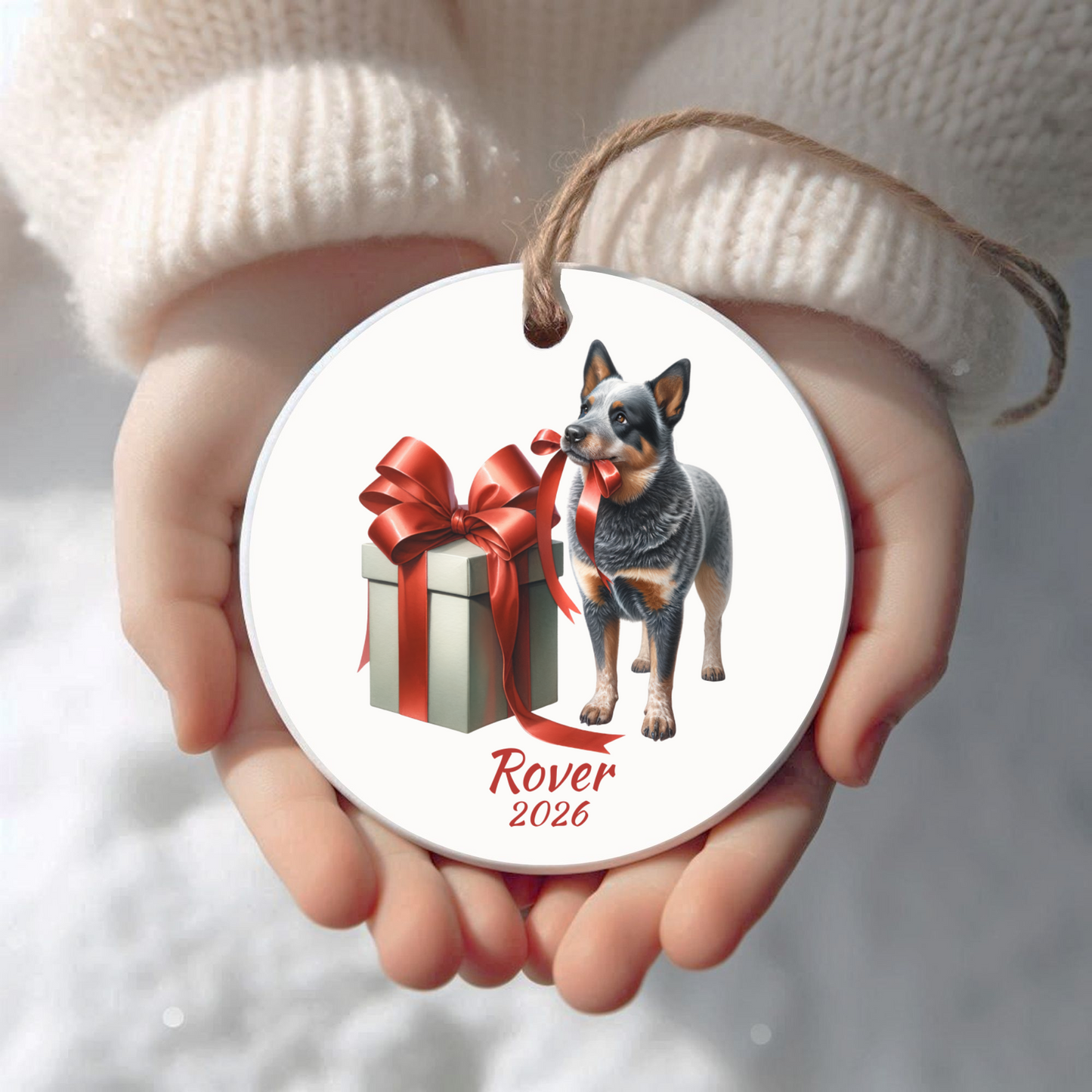 Personalized Australian Cattle Dog Christmas ornament held in cupped hands