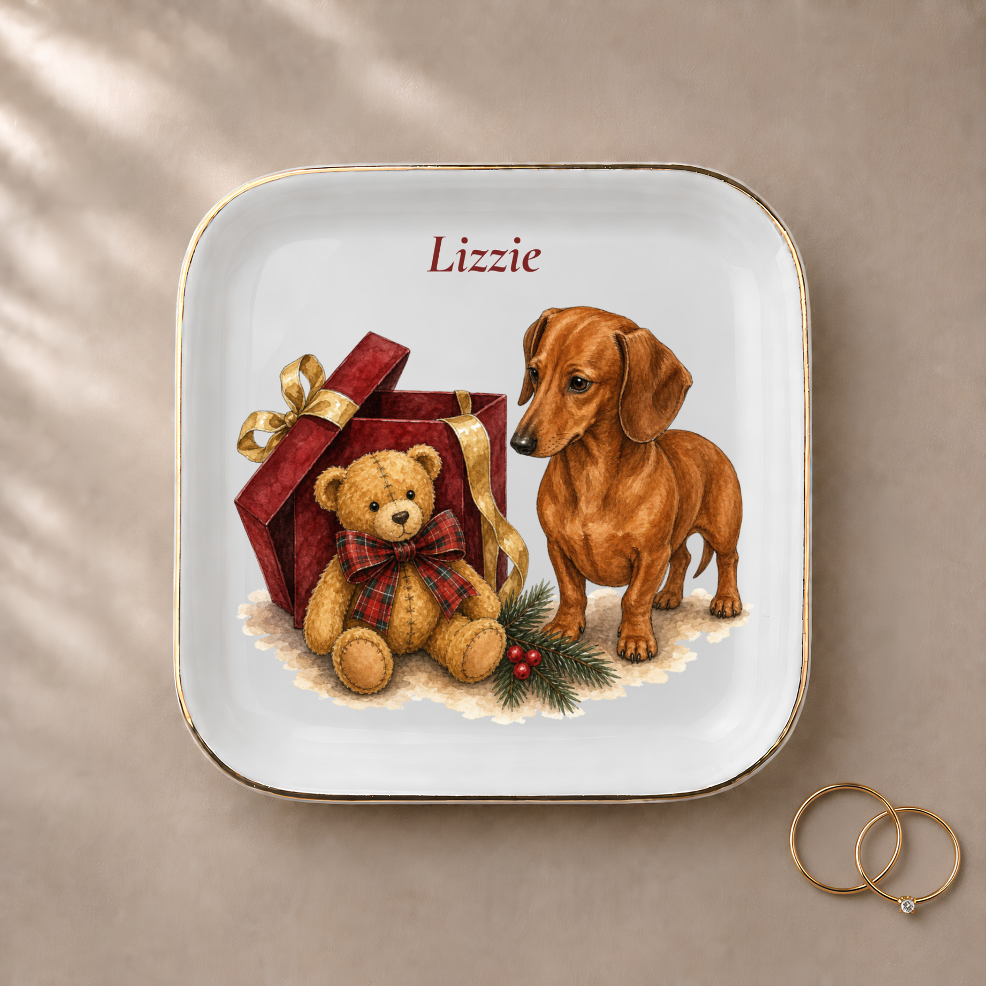 Dachshund jewelry dish styled with gold rings and a personalized name