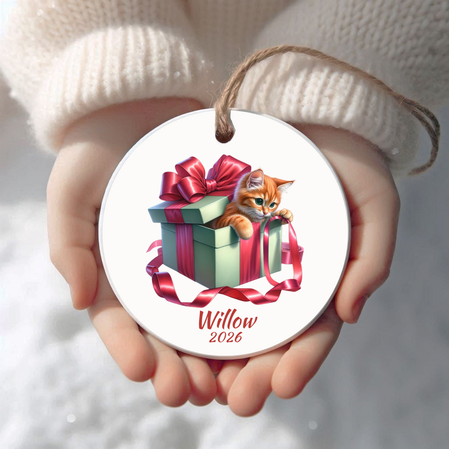Personalized Orange Cat Christmas ornament held in cupped hands