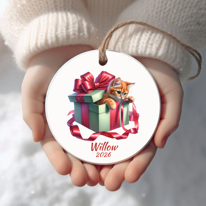 Personalized Orange Cat Christmas ornament held in cupped hands