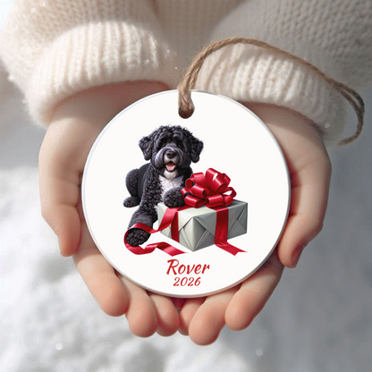 Personalized Portuguese Water Dog Christmas ornament held in cupped hands