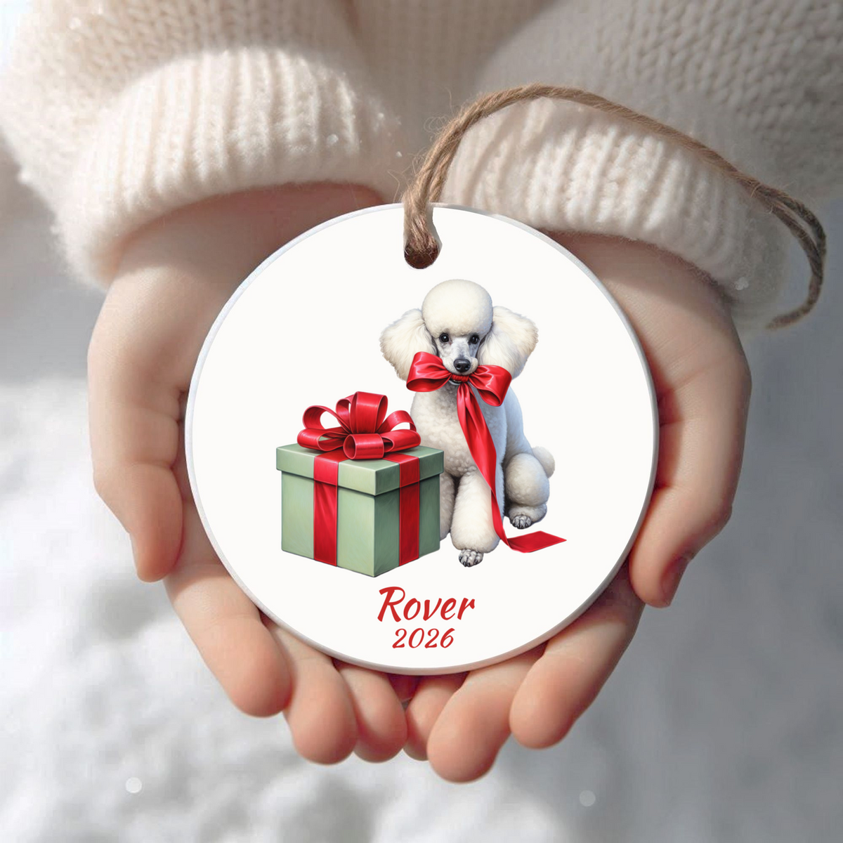 Personalized white Standard Poodle Christmas ornament held in cupped hands