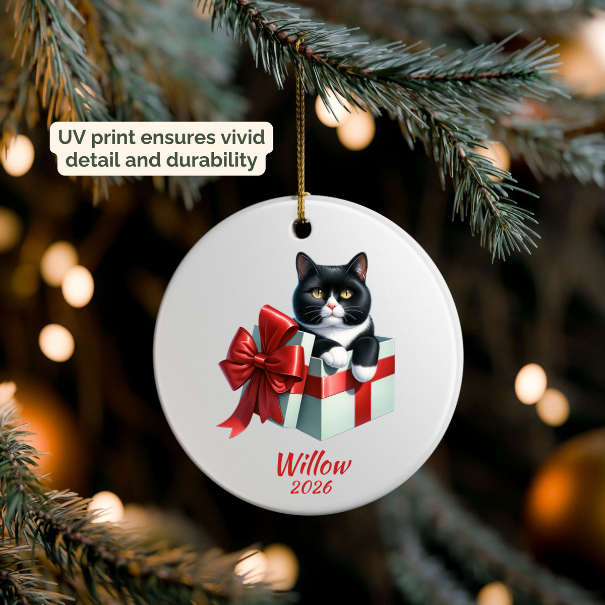 Personalized Tuxedo Cat ornament hanging on a lit Christmas tree