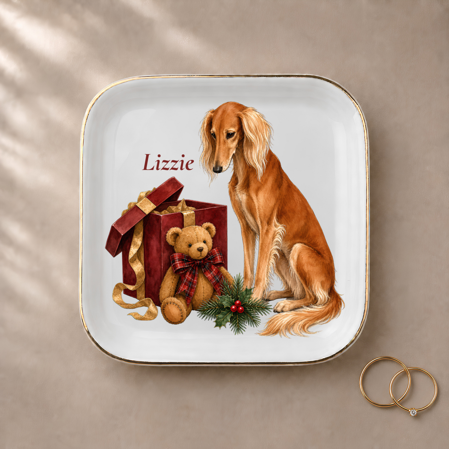 Saluki jewelry dish styled with gold rings and a personalized name