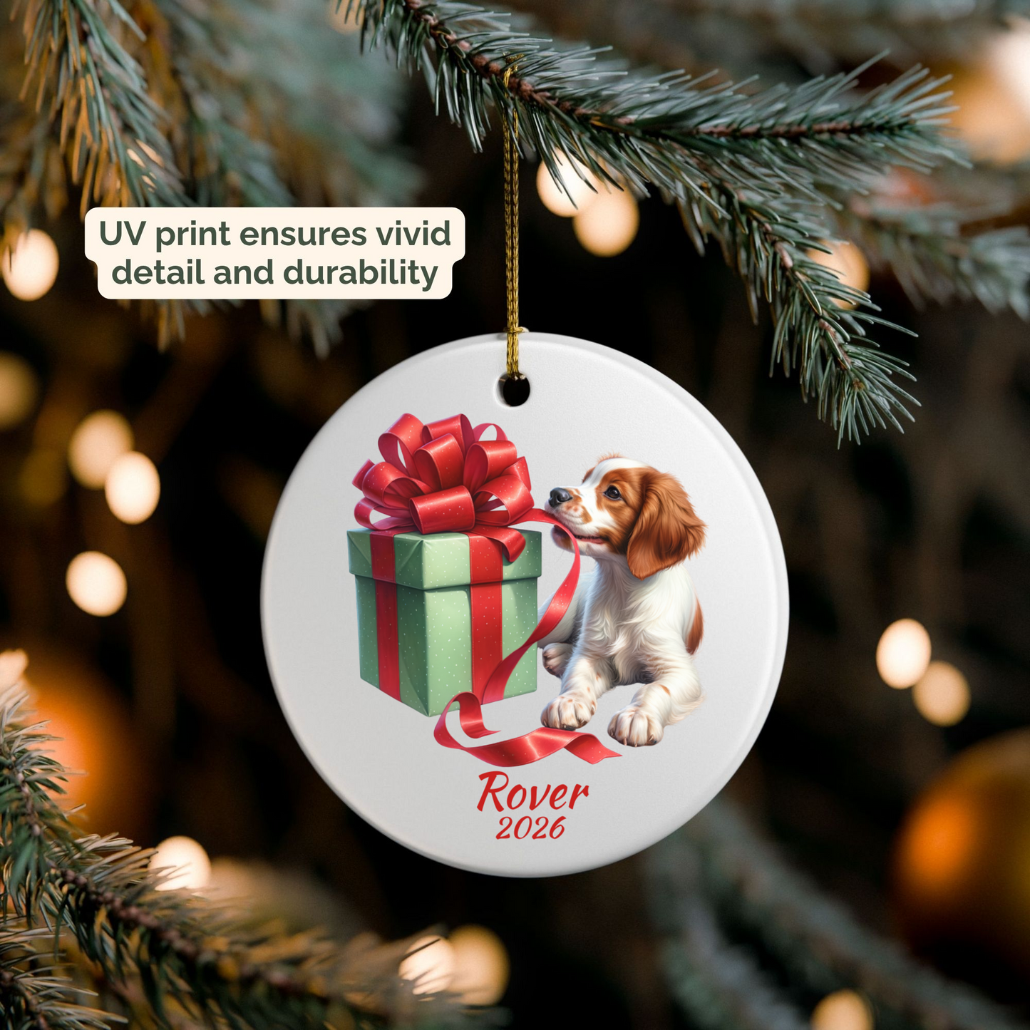 Personalized Brittany Spaniel ornament hanging on a lit Christmas tree
