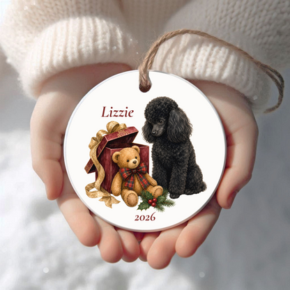 Personalized Miniature Poodle (Black) Christmas ornament held in cupped hands
