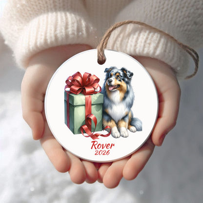 Personalized Australian Shepherd Christmas ornament held in cupped hands