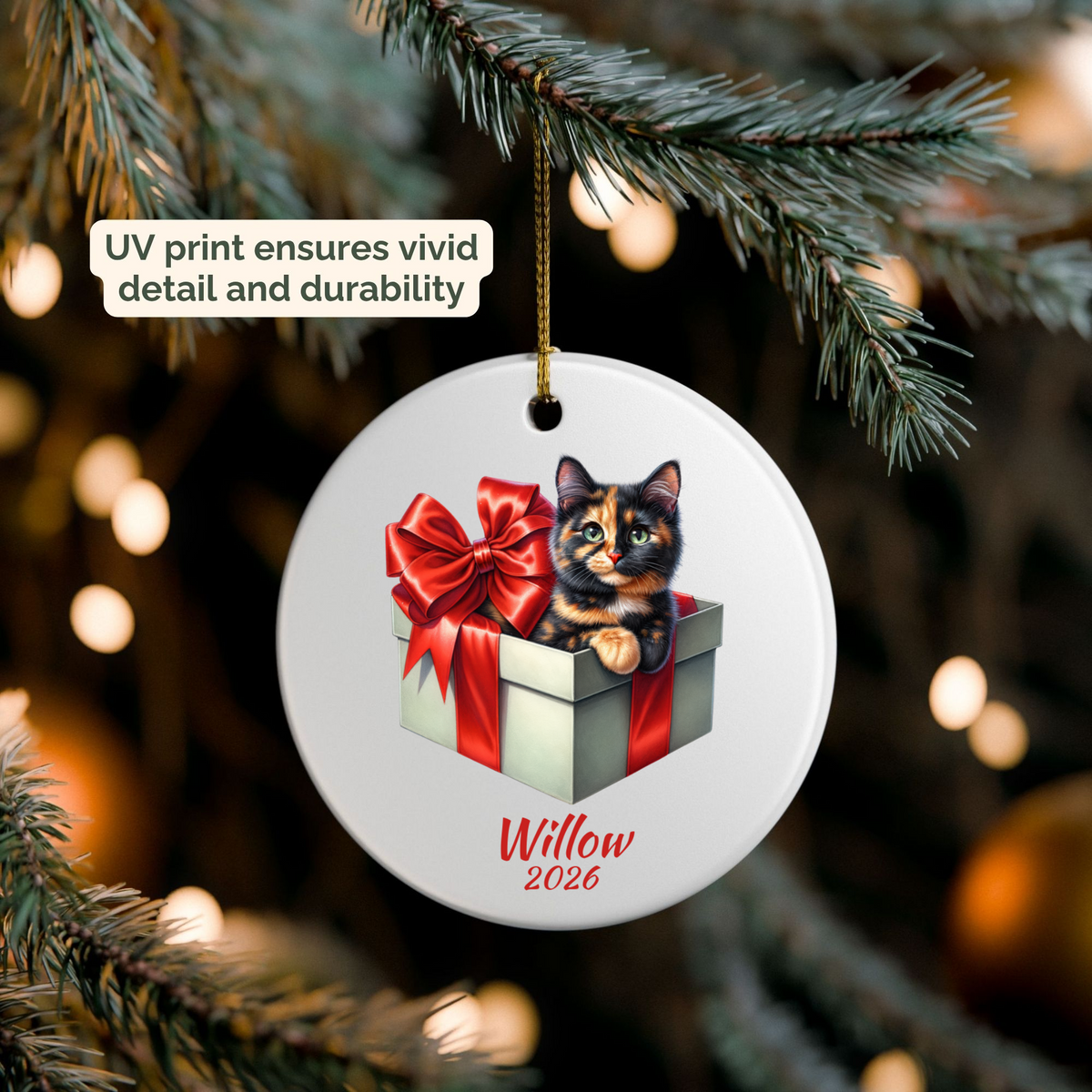 Personalized Tortie Cat ornament hanging on a lit Christmas tree