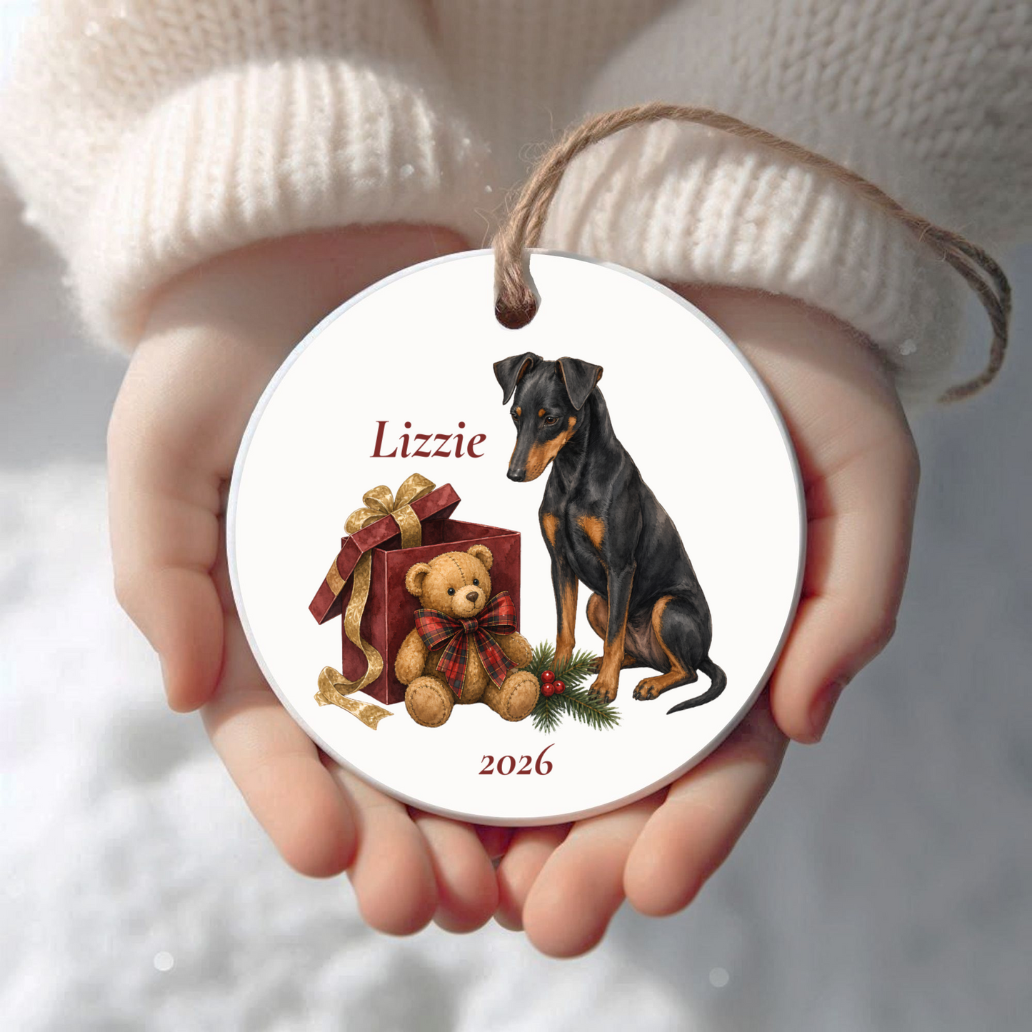 Personalized Manchester Terrier Christmas ornament held in cupped hands