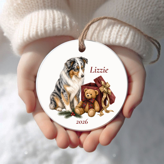 Personalized Australian Shepherd Christmas ornament held in cupped hands
